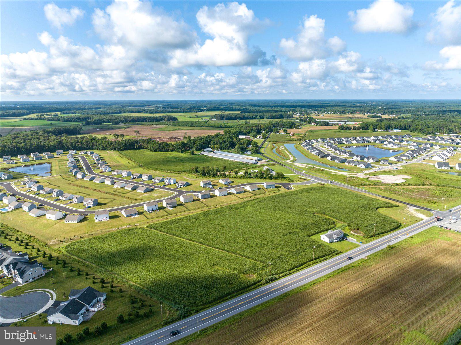 32474 Lighthouse Road Selbyville, DE 19975 - Photo 6 of 26 a view of a golf course with a lake view