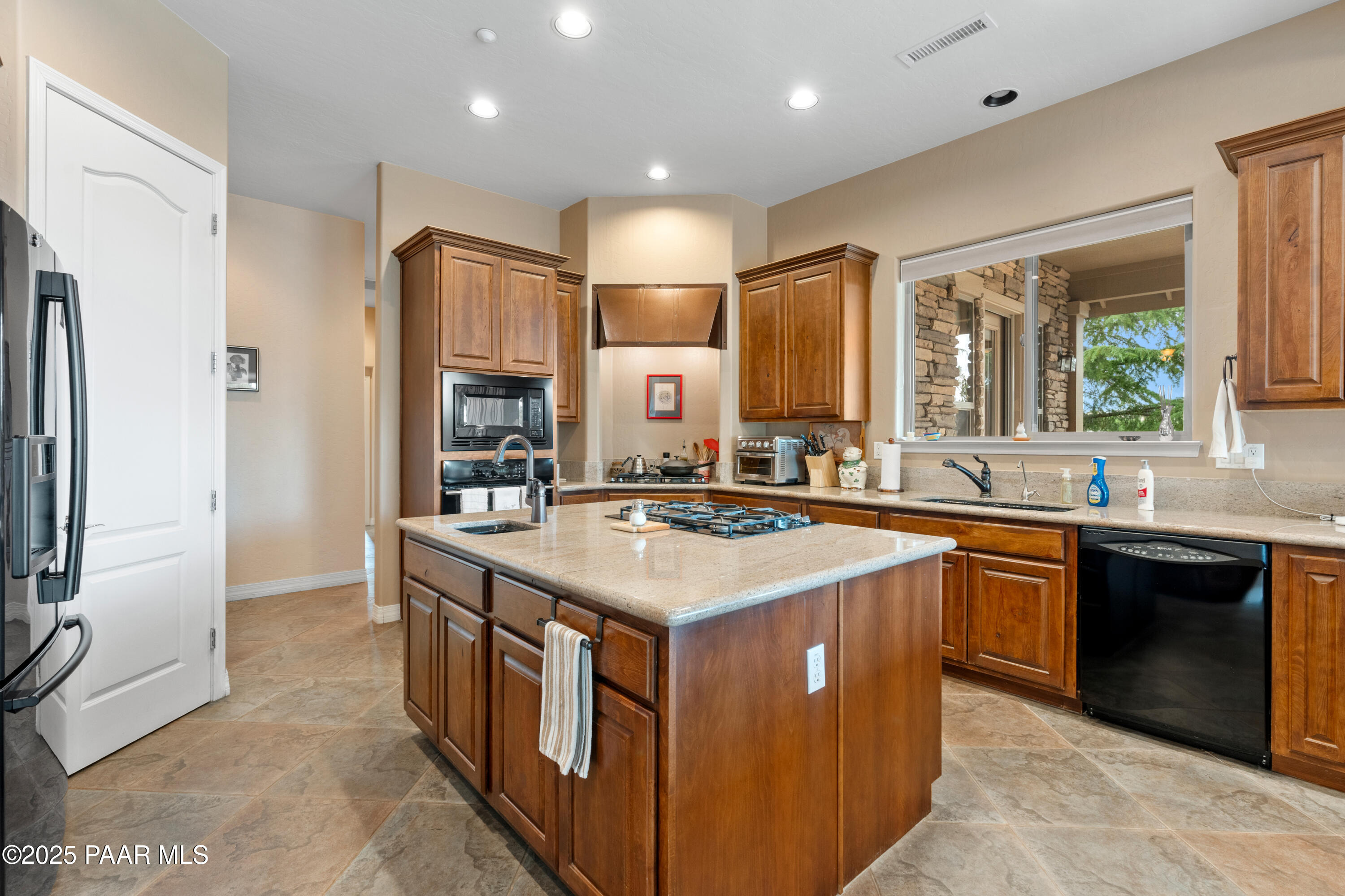 2117 Colter Bay Court Prescott, AZ 86301 - Photo 18 of 45 a kitchen with stainless steel appliances granite countertop a sink stove and refrigerator