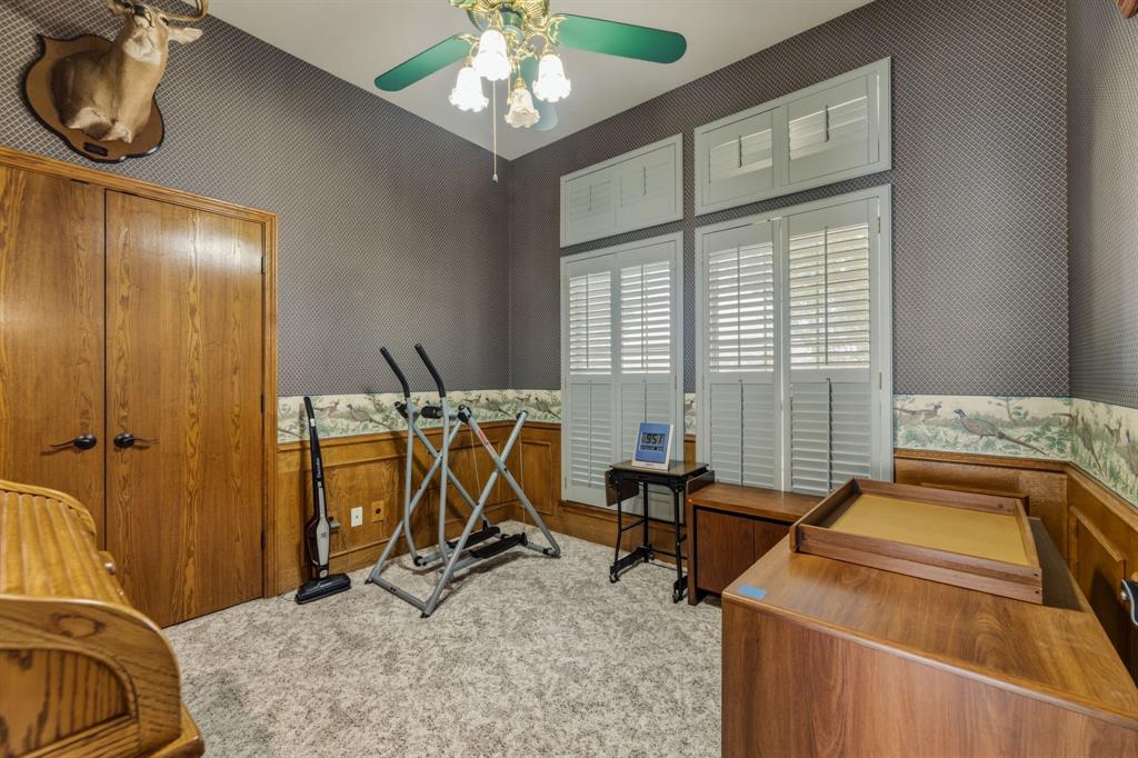 130 Blazek Road Alma, TX 75119 - Photo 23 of 34 a room with gym equipment and windows