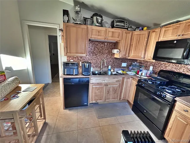 a living room with furniture and book shelf