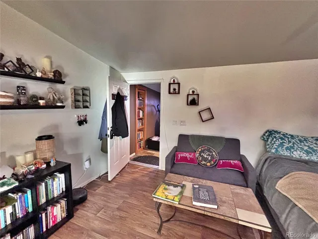 a bedroom with a bed and flat screen tv