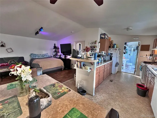 a kitchen with furniture and a stove