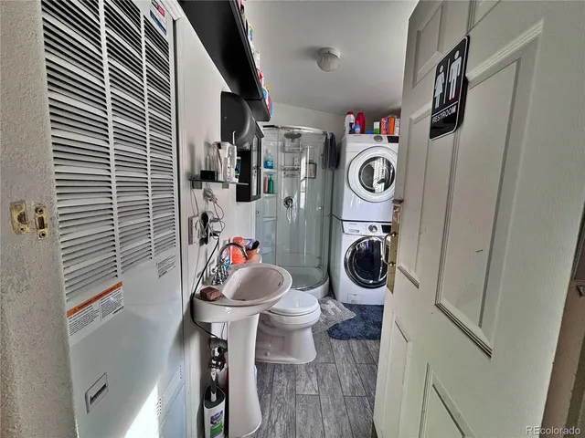 a bathroom with a toilet mirror and vanity