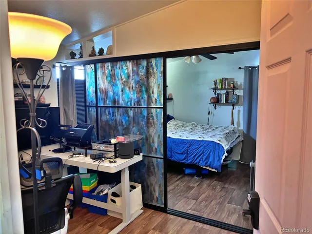 a view of workspace with wooden floor shelves