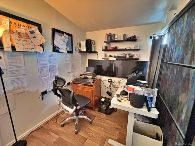 a room with furniture and a flat screen tv