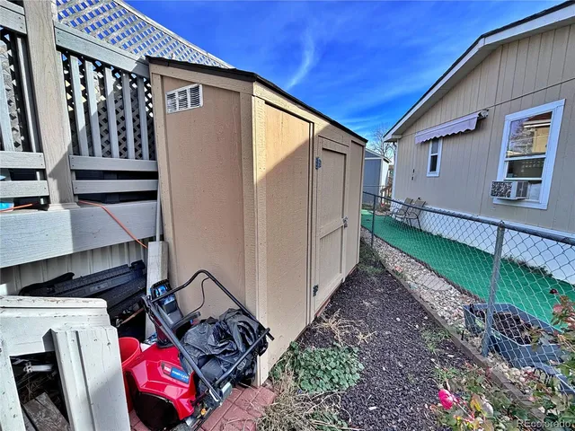 a view of a patio with a table and chairs