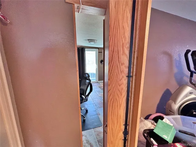 a living room with furniture and a mirror