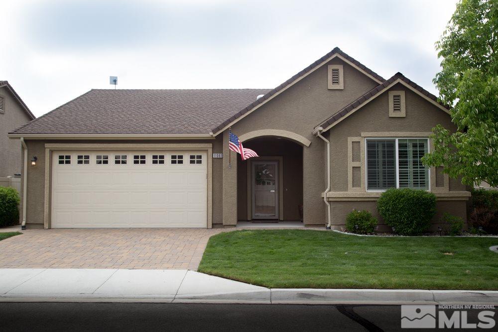 11061 Colton Drive Reno, NV 89521 - Photo 1 of 24 a front view of a house with a garden and yard