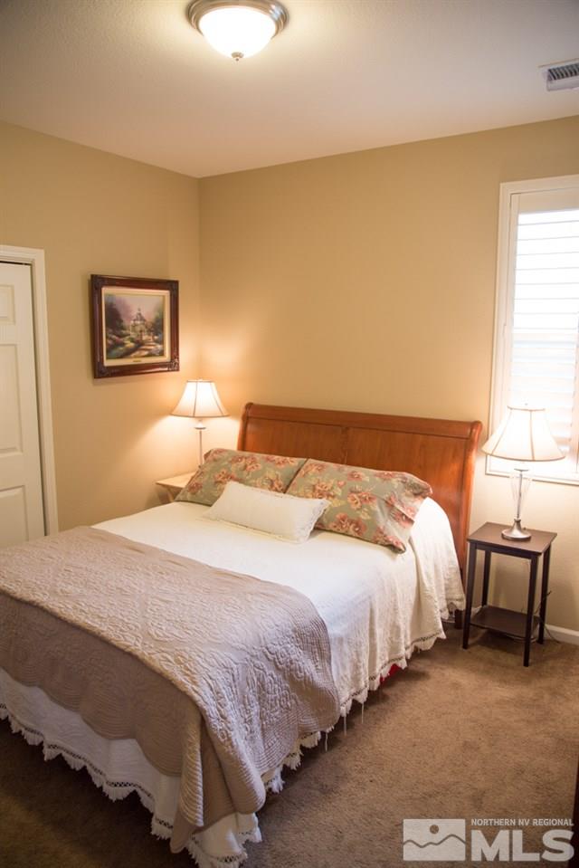 11061 Colton Drive Reno, NV 89521 - Photo 12 of 24 a bedroom with bed and window
