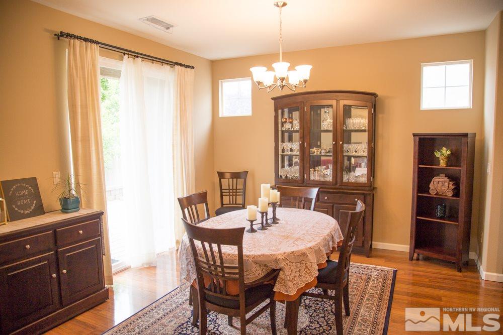 11061 Colton Drive Reno, NV 89521 - Photo 3 of 24 a view of a dining room with furniture window and wooden floor