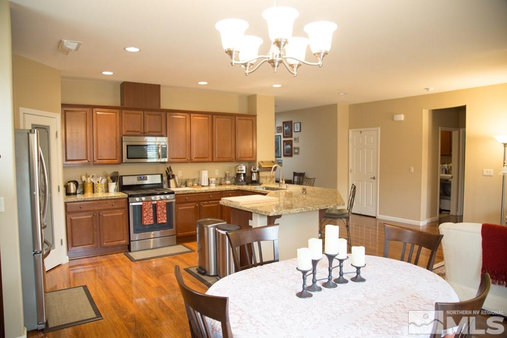 11061 Colton Drive Reno, NV 89521 - Photo 6 of 24 a large kitchen with a table and chairs