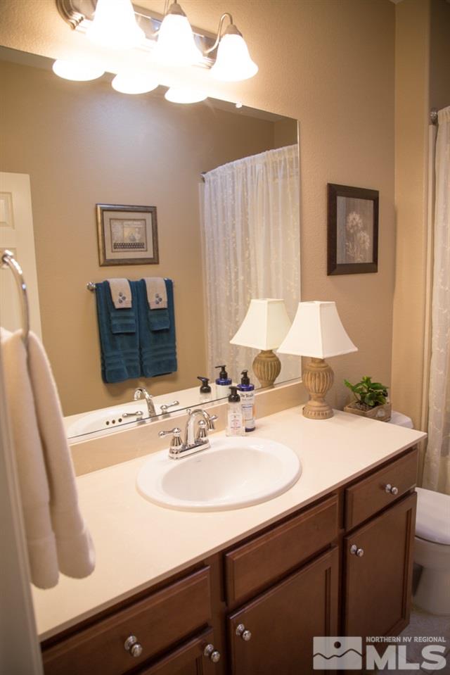 11061 Colton Drive Reno, NV 89521 - Photo 10 of 24 a bathroom with a sink and a mirror