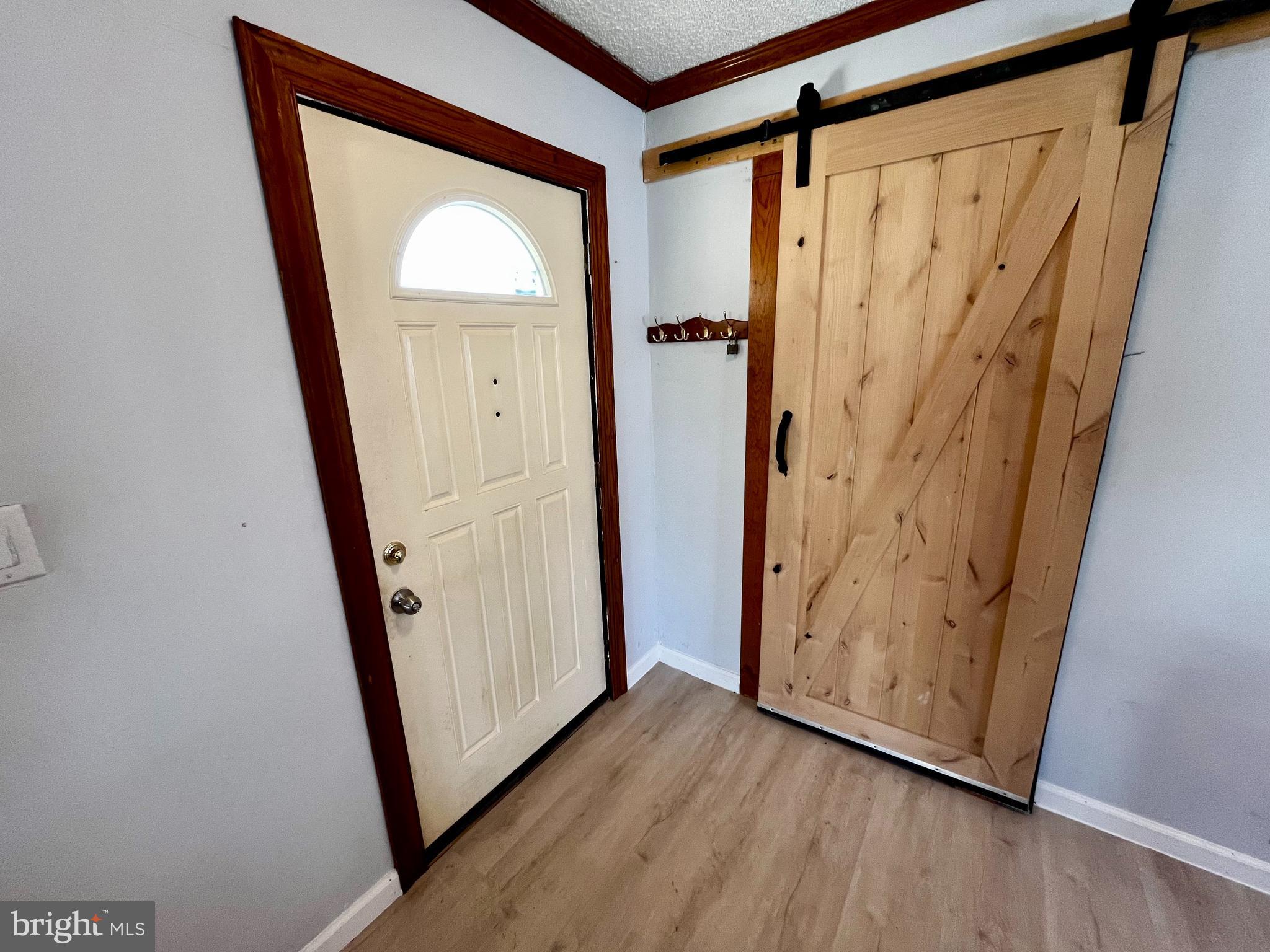 1 Hornsby Drive Marlton, NJ 08053 - Photo 2 of 22 a view of a hallway with wooden floor and stairs