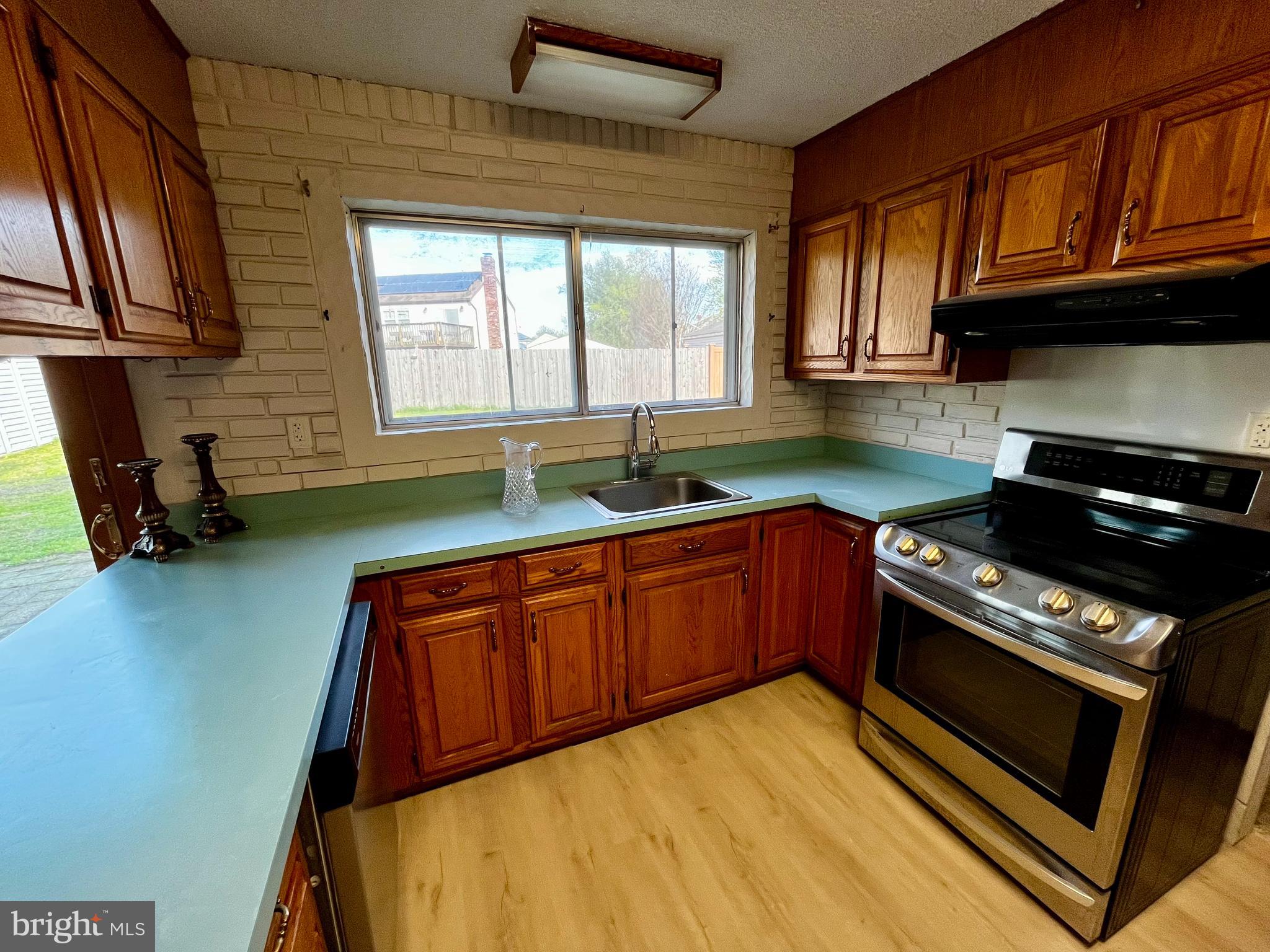 1 Hornsby Drive Marlton, NJ 08053 - Photo 8 of 22 a kitchen with granite countertop cabinets stainless steel appliances a sink and a window
