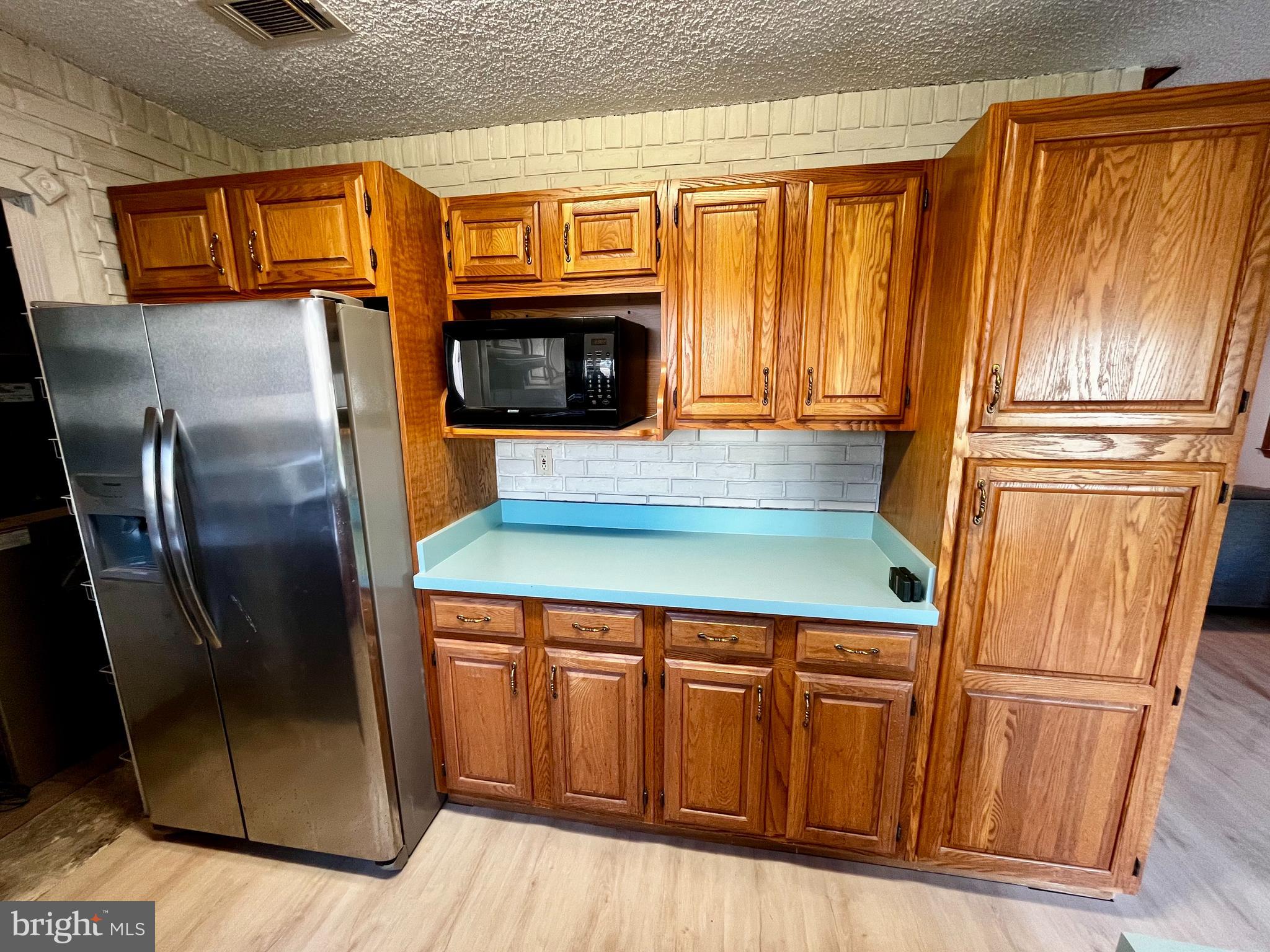 1 Hornsby Drive Marlton, NJ 08053 - Photo 9 of 22 a kitchen with stainless steel appliances granite countertop a refrigerator a microwave oven cabinets and a sink