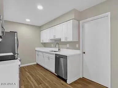 a kitchen with a sink stove and refrigerator