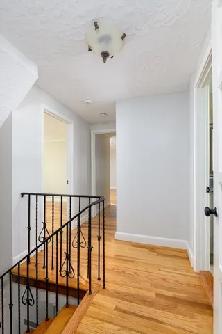 a view of bedroom with wooden floor