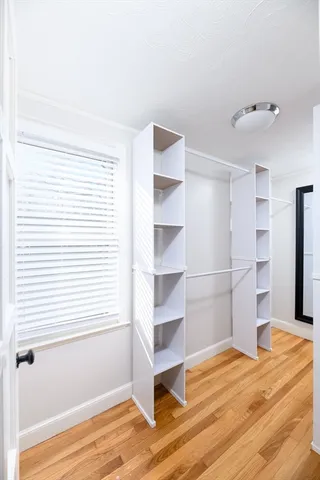 a view of wooden floor and windows in a room