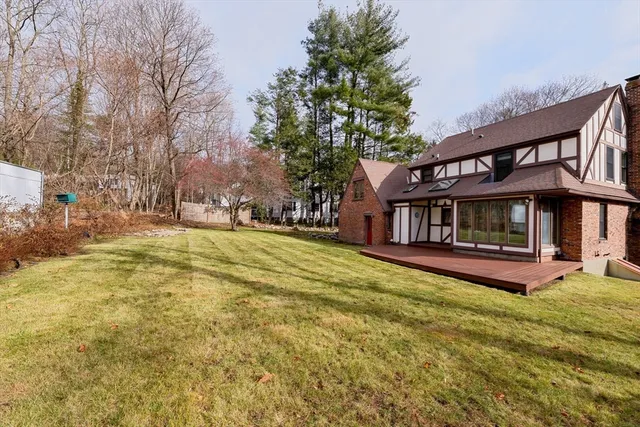 a view of house with outdoor space and garden