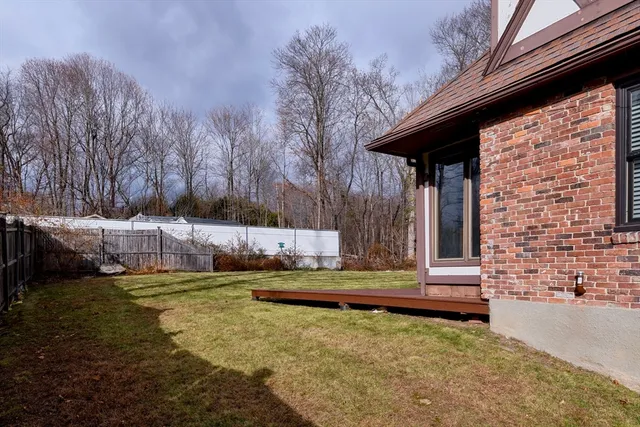 a view of a backyard with swimming pool