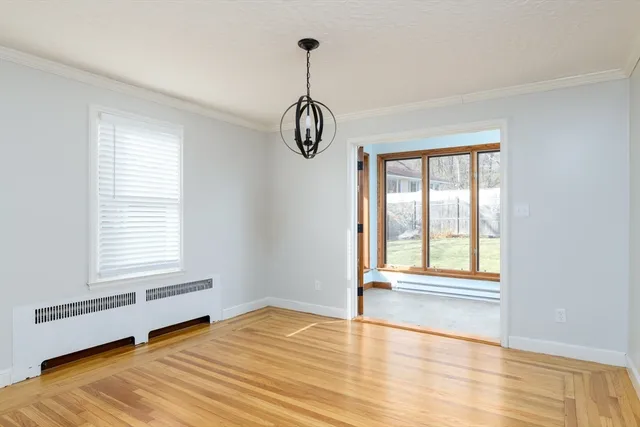 a room with a window and a ceiling fan