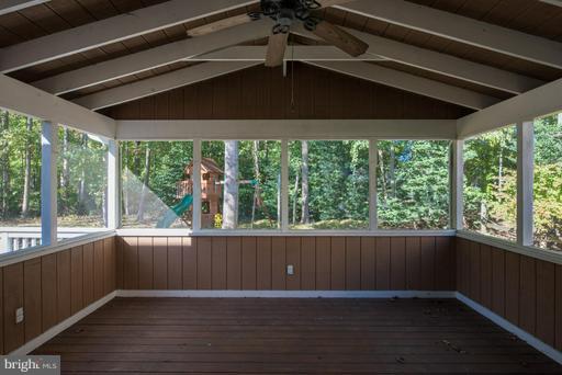 1404 Hunting Wood Road Annapolis, MD 21403 - Photo 12 of 15 a view of an empty room with wooden floor and a window