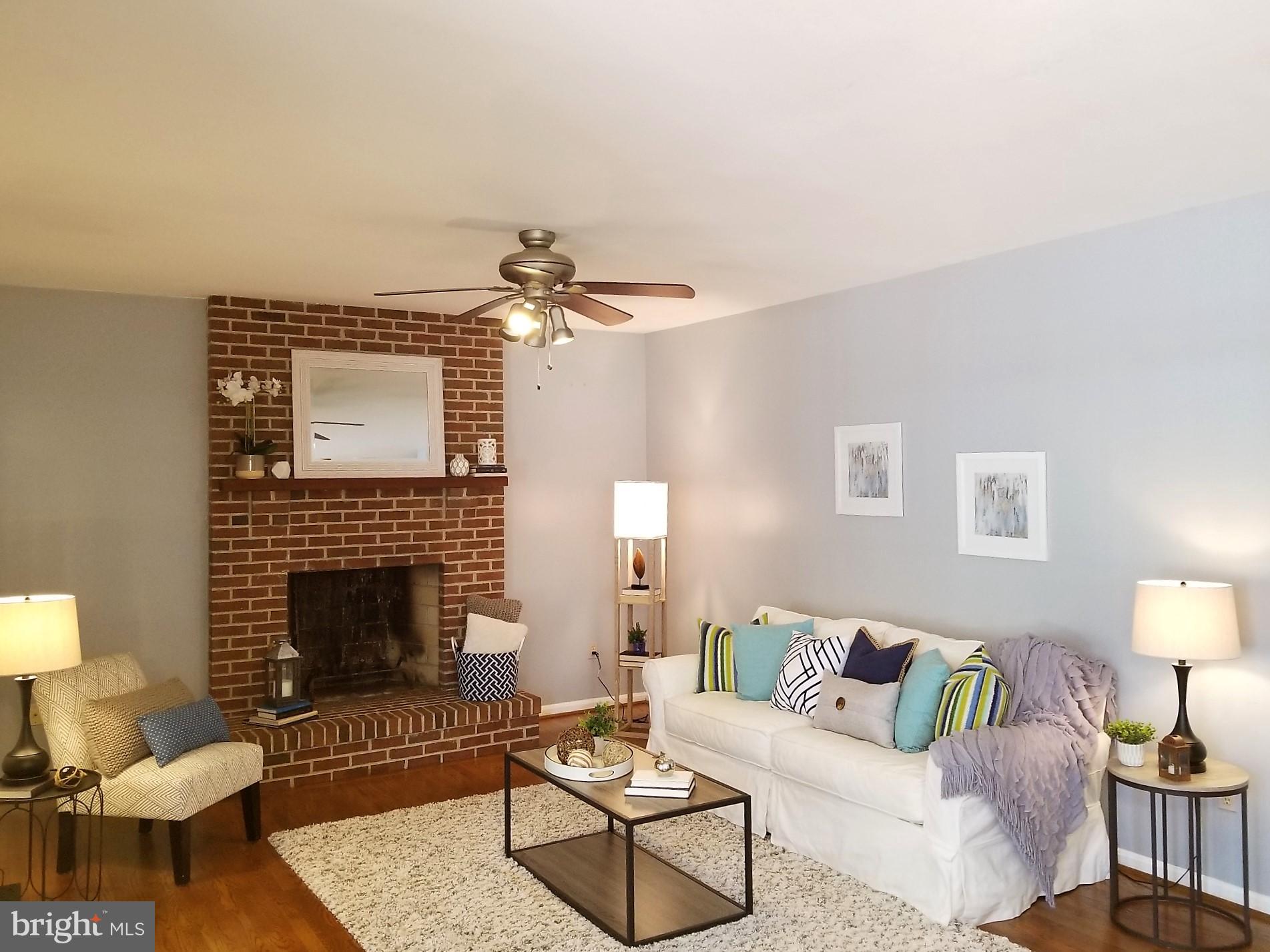 1404 Hunting Wood Road Annapolis, MD 21403 - Photo 4 of 15 a living room with furniture and a fireplace
