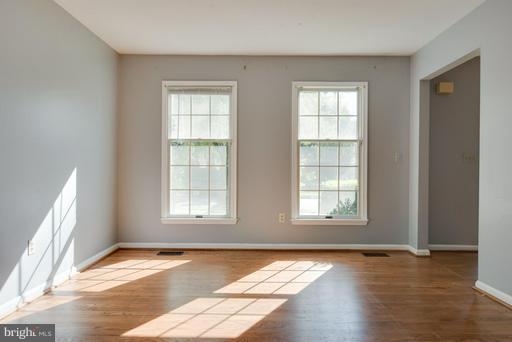 1404 Hunting Wood Road Annapolis, MD 21403 - Photo 6 of 15 a view of an empty room with wooden floor and a window