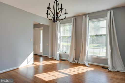 1404 Hunting Wood Road Annapolis, MD 21403 - Photo 7 of 15 a view of an empty room with wooden floor and window