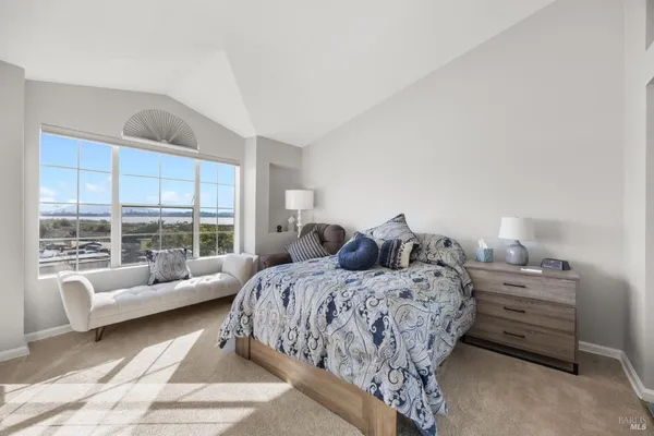 a bed room with bed and windows