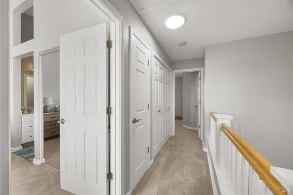a view of a hallway with closet and entryway