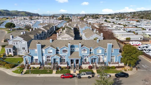 an aerial view of residential houses with outdoor space