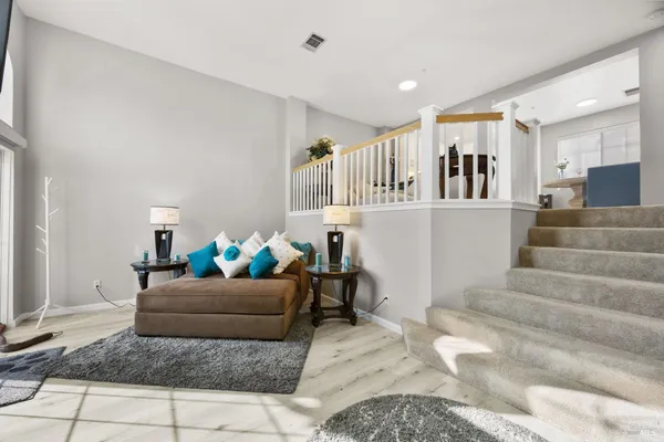 a living room with furniture and a rug