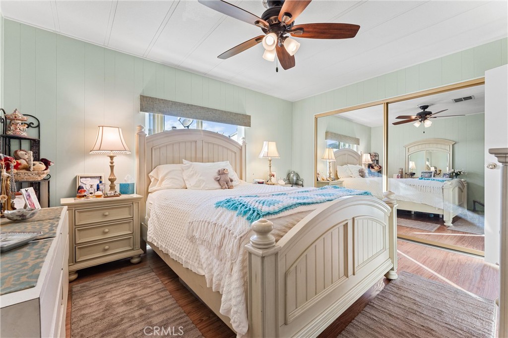 692 North Adele, Unit 64 Orange, CA 92867 - Photo 11 of 16 a bedroom with a bed and a chandelier