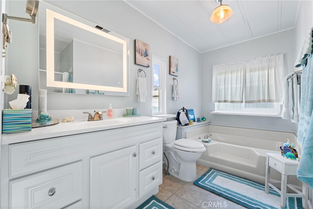 692 North Adele, Unit 64 Orange, CA 92867 - Photo 12 of 16 a bathroom with a sink a toilet and a bathtub