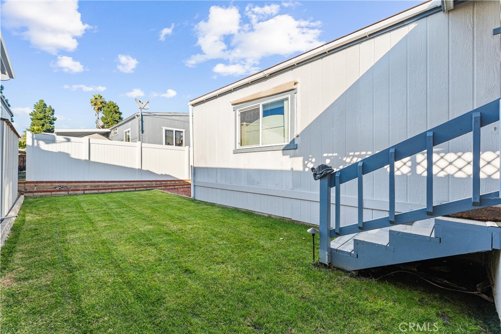 692 North Adele, Unit 64 Orange, CA 92867 - Photo 16 of 16 a view of a house with a backyard and a patio