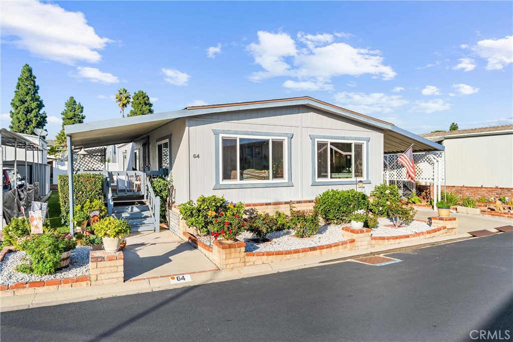 692 North Adele, Unit 64 Orange, CA 92867 - Photo 2 of 16 a front view of a house with garden