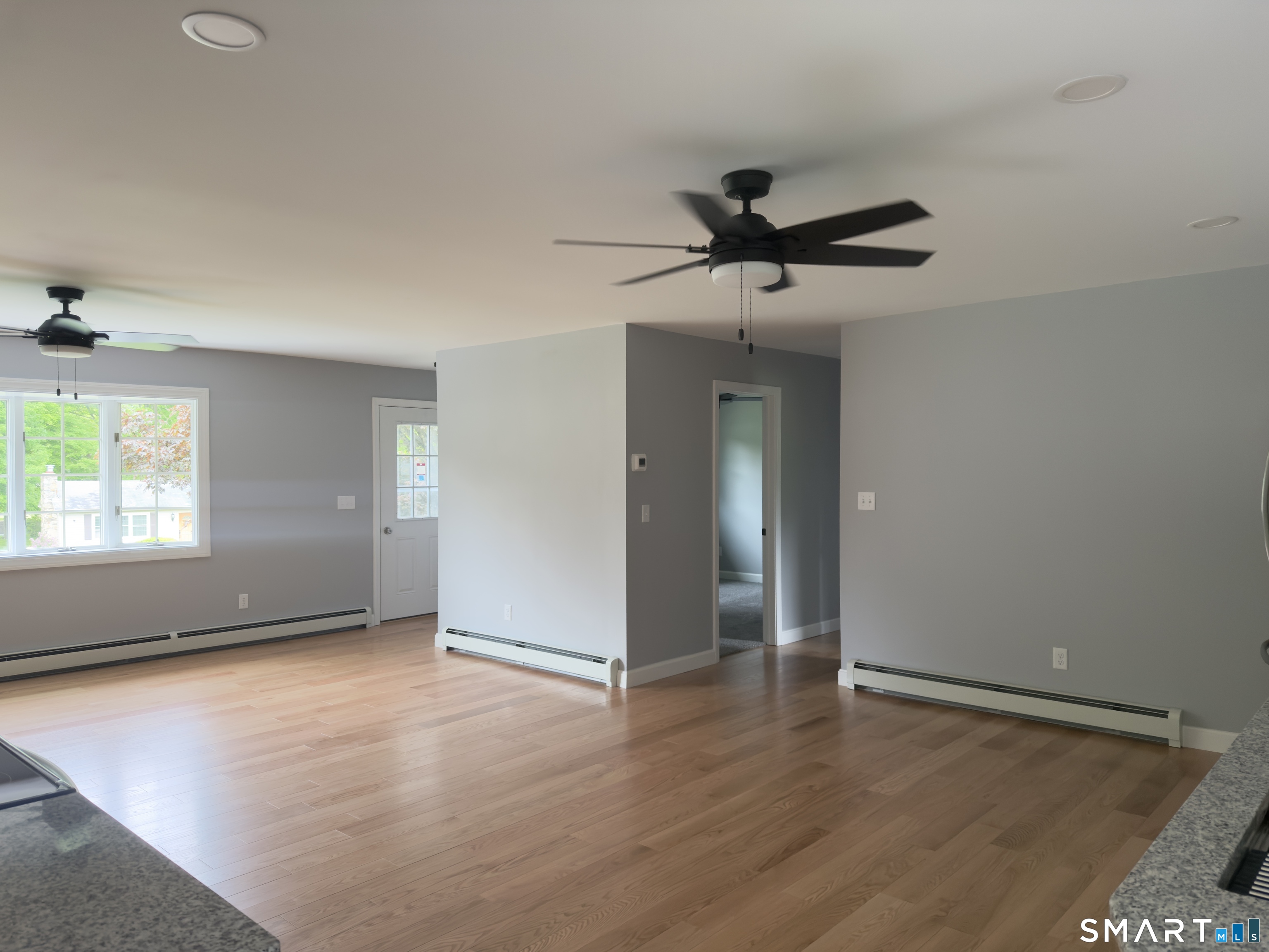 44 Polly Avenue Killingly, CT 06239 - Photo 12 of 22 an empty room with wooden floor and windows