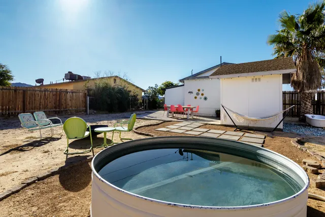 a view of swimming pool having outdoor seating