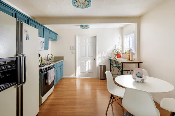 a kitchen with kitchen island a stove and a sink
