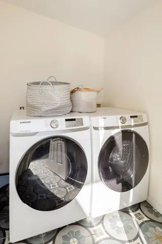 a utility room with dryer and washer