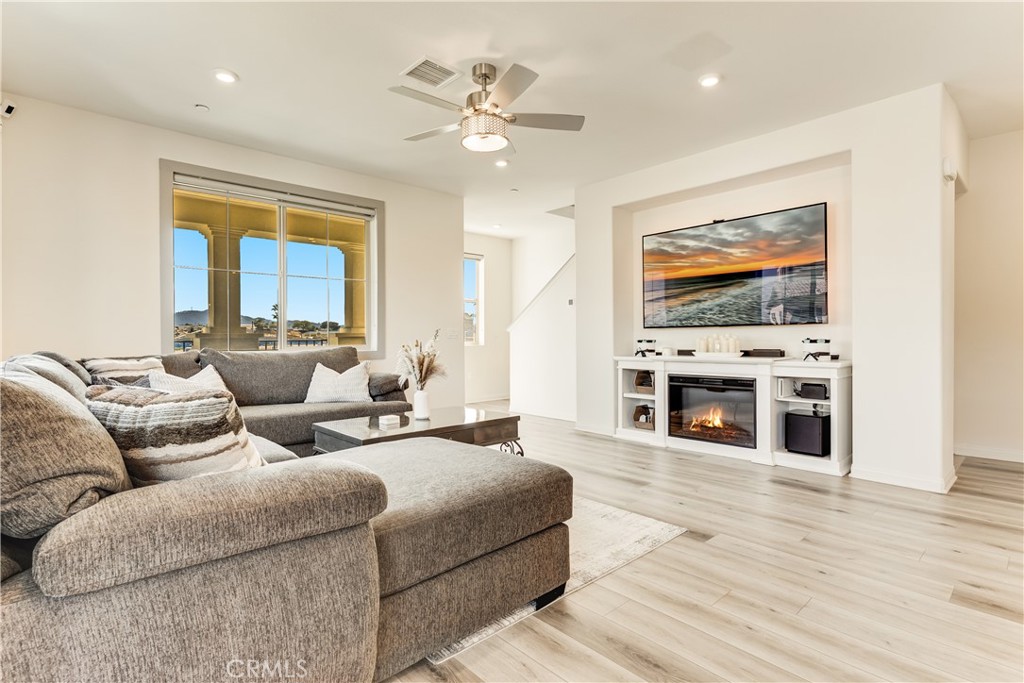 1648 Fig Tree Way Oceanside, CA 92056 - Photo 14 of 45 a living room with furniture and a flat screen tv