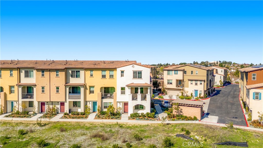 1648 Fig Tree Way Oceanside, CA 92056 - Photo 19 of 45 a front view of a building with street view