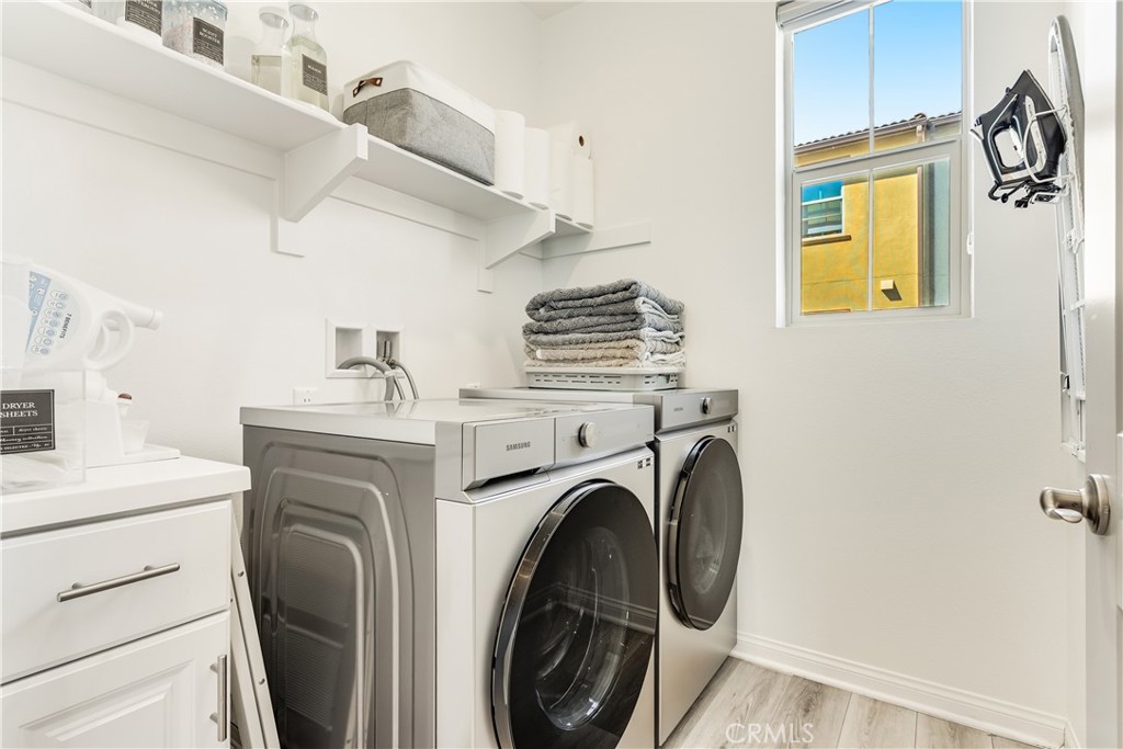 1648 Fig Tree Way Oceanside, CA 92056 - Photo 26 of 45 a view of washer and dryer in a utility room