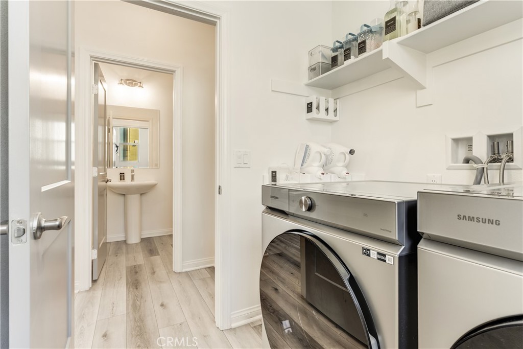 1648 Fig Tree Way Oceanside, CA 92056 - Photo 27 of 45 a utility room with closet dryer and washer