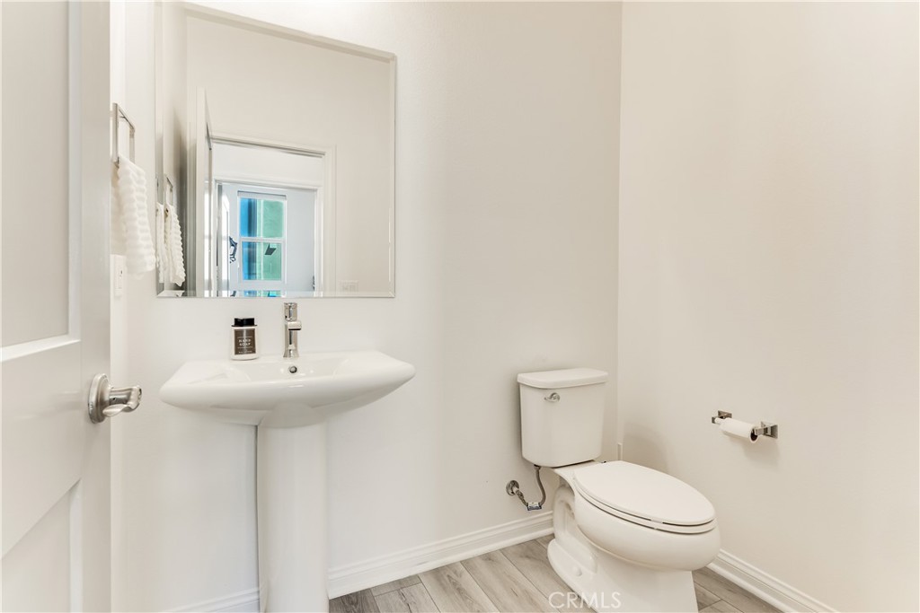 1648 Fig Tree Way Oceanside, CA 92056 - Photo 32 of 45 a bathroom with a sink toilet and a mirror