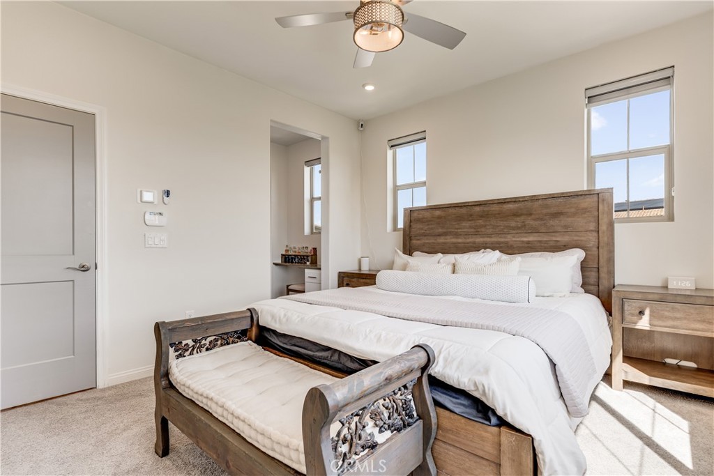 1648 Fig Tree Way Oceanside, CA 92056 - Photo 33 of 45 a bedroom with a bed and window