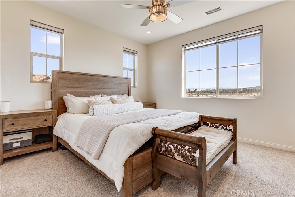 1648 Fig Tree Way Oceanside, CA 92056 - Photo 34 of 45 a bedroom with a bed and window