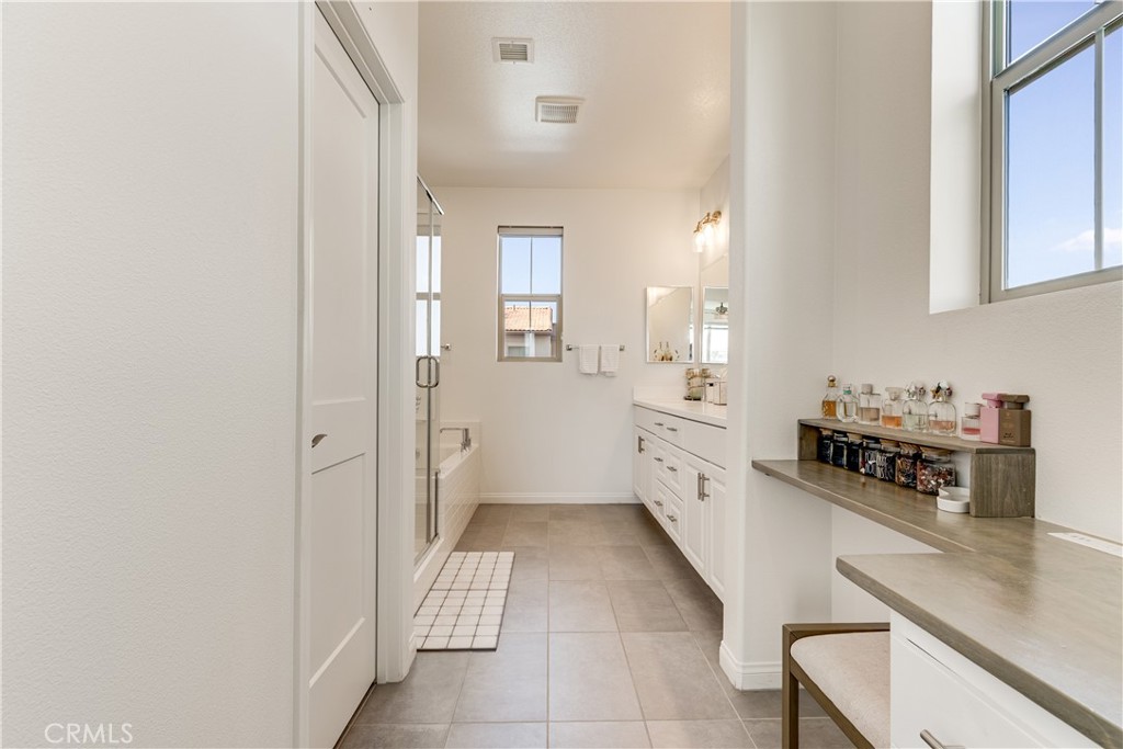 1648 Fig Tree Way Oceanside, CA 92056 - Photo 35 of 45 a large white kitchen with white cabinets