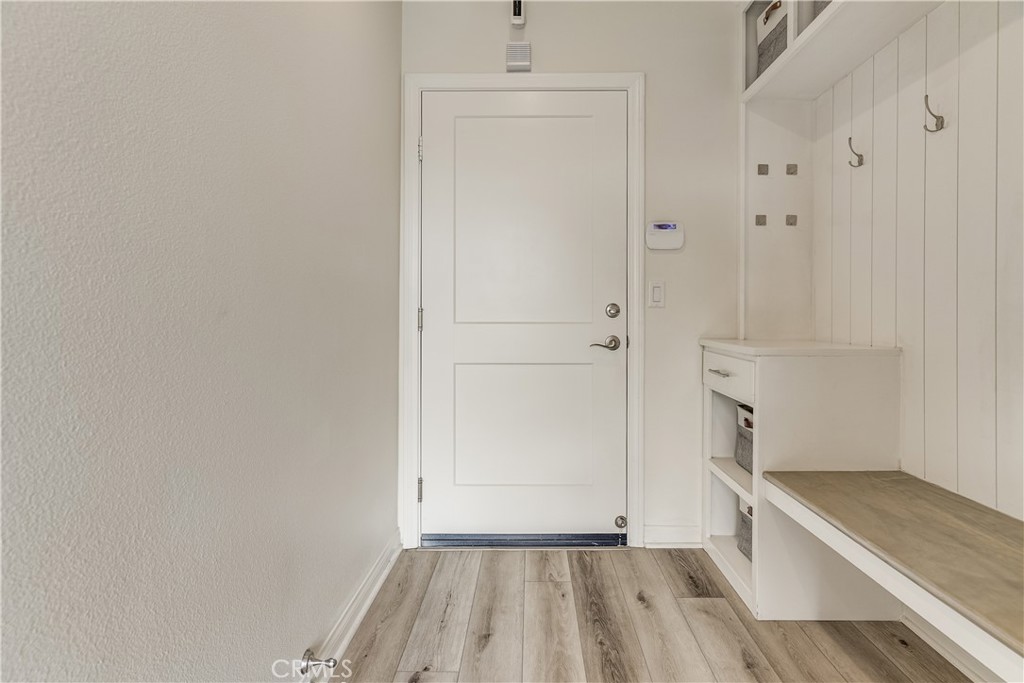 1648 Fig Tree Way Oceanside, CA 92056 - Photo 4 of 45 a view of room with hardwood floor and a sink